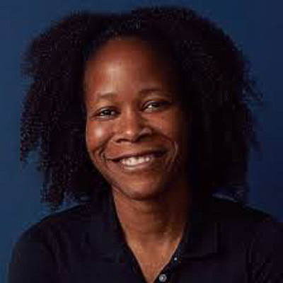 Masheika Allgood. AllAI Consulting. Wearing a dark shirt, in front of a dark blue background.