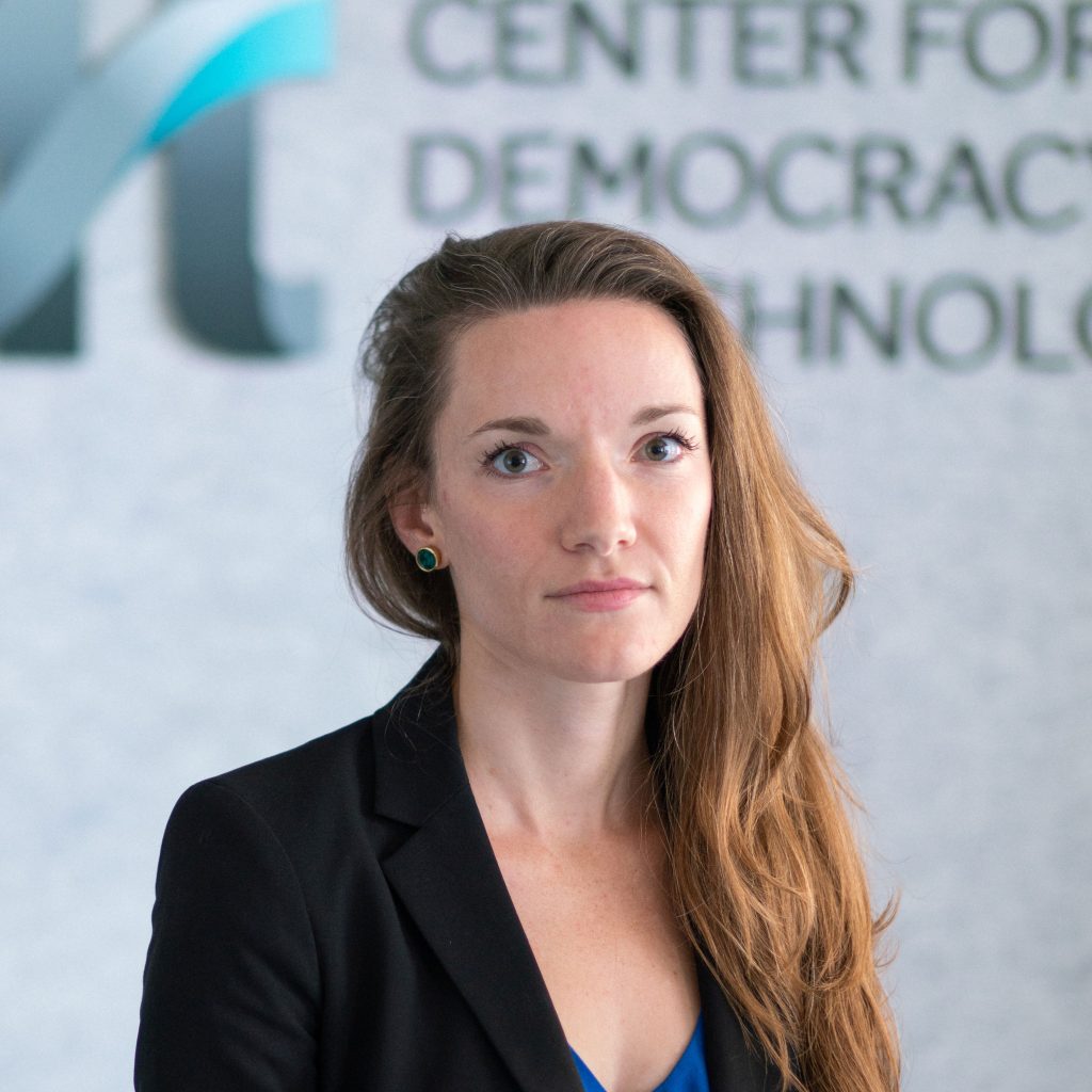 Hannah Quay de la Vallee, wearing a jacket in front of the CDT logo.