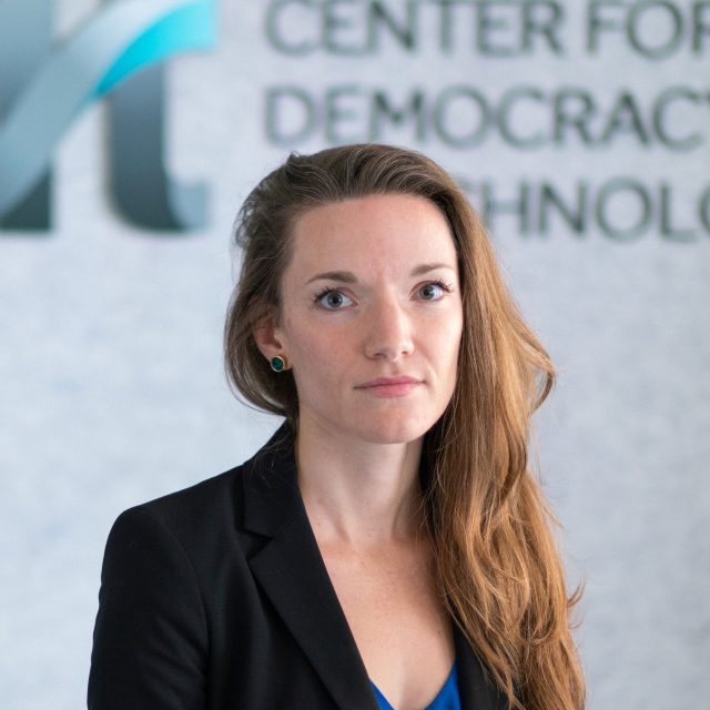 Hannah Quay de la Vallee, wearing a jacket in front of the CDT logo.