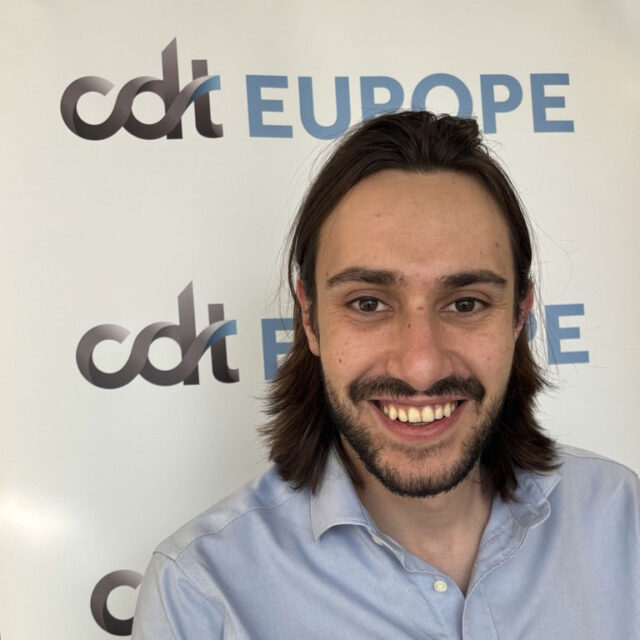 Marcel Mir, smiling in a collared shirt, in front of the CDT Europe backdrop.