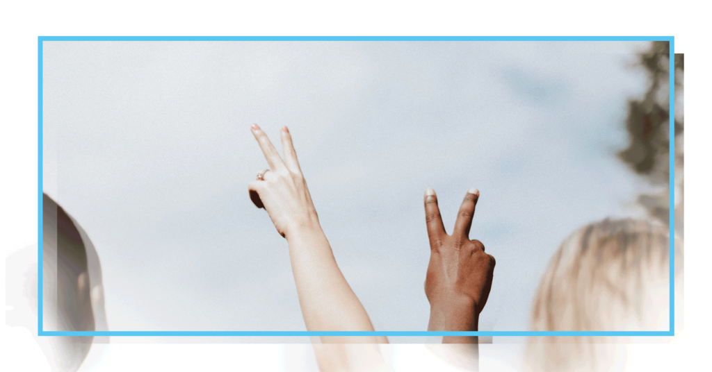 Graphic for feature story in CDT's 2022 annual report, focused on defending democracy in a digital world. Two different hands, making peace signs towards the blue sky.